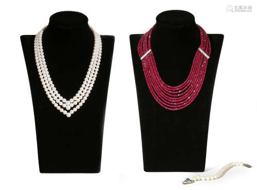 A nine-row ruby bead necklace, separated with diamond-set spacers with white gold clasp, 50cm