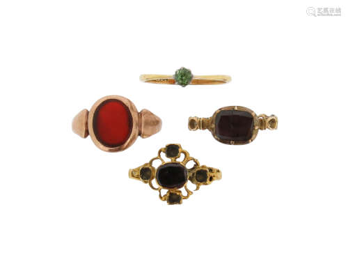 An early 18th century flat garnet (cracked) mounted gold ring, with interwoven shank, size L, a