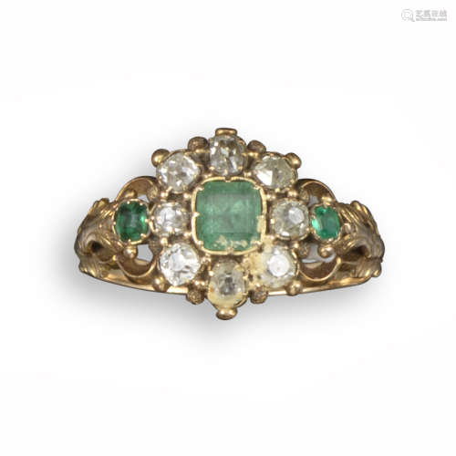 A late George III emerald and diamond cluster ring, set with three emeralds in closed-back mounts