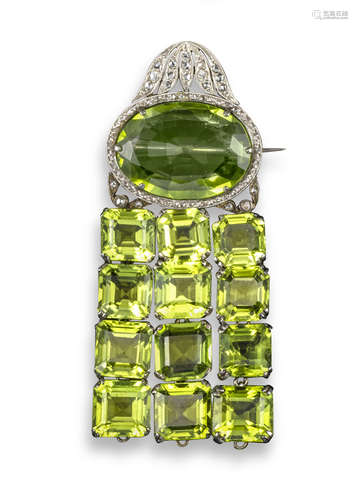 An early 20th century peridot and diamond brooch, the oval-shaped peridot set within rose-cut