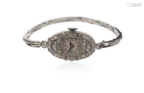 A lady's diamond-set cocktail wristwatch by Benson, the silver dial with black Arabic numerals.