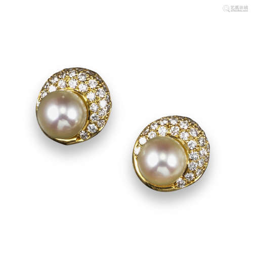 A pair of cultured pearl and diamond-set yellow gold ear studs, the pearls are mounted within a