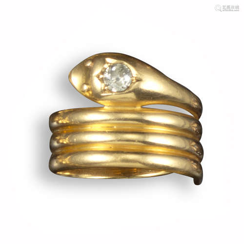 A Victorian diamond-set snake ring, the coiled serpent with a diamond-set head in yellow gold,