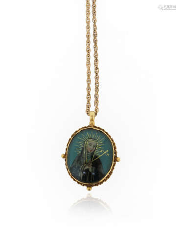 An 18th century reliquary pendant, depicting The Virgin Mary to one side and St Francis to the