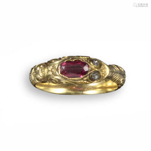 An early 19th century gold snake ring, the head set with an oval-shaped garnet and with rose-cut