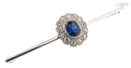 A sapphire and diamond bar brooch, the cushion-shaped sapphire set within a surround of cushion-