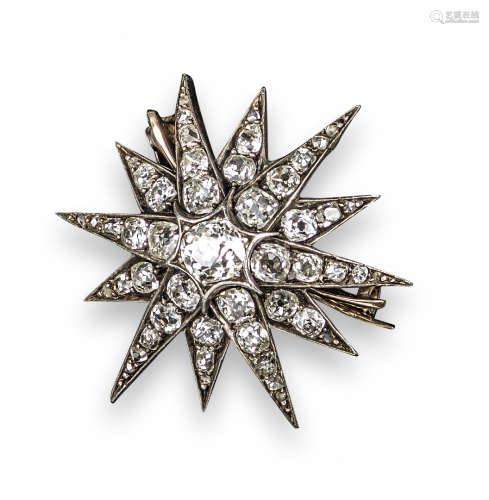 A late 19th century diamond starburst brooch, set overall with graduated old cushion-shaped diamonds