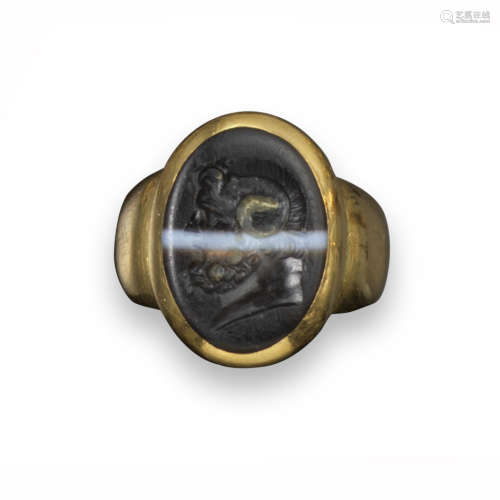 An oval carved agate intaglio depicting Zeus Ammon, bearded and with horns, possibly Hellenistic,