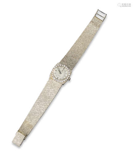 A lady's diamond-set Omega wristwatch, the signed dial with baton numerals, circular-cut diamonds to