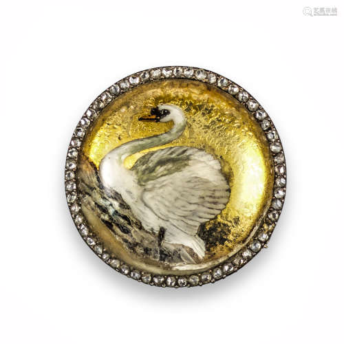 A late 19th century reverse carved crystal brooch, realistically depicting a swan within rose-cut
