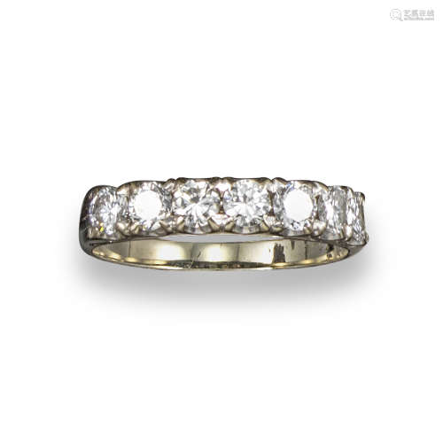 A diamond seven stone ring, set with circular brilliant-cut diamonds in yellow gold, size S