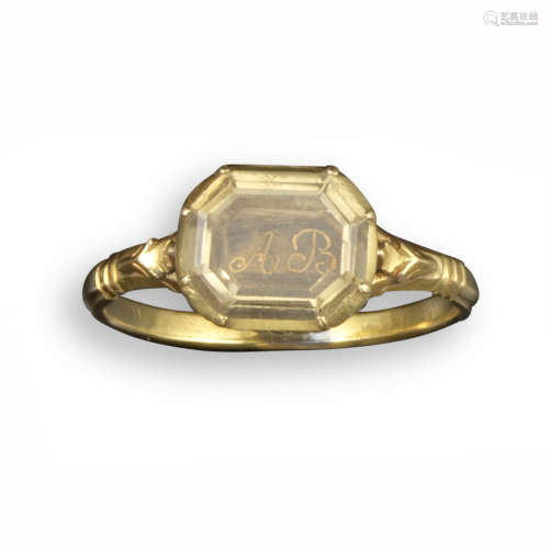 A Stuart crystal-mounted gold ring, the octagonal-shaped crystal covers the gold wire letters AB,