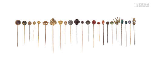Twenty-three assorted stick pins, of various designs including an owl, a dogs mask and some set with