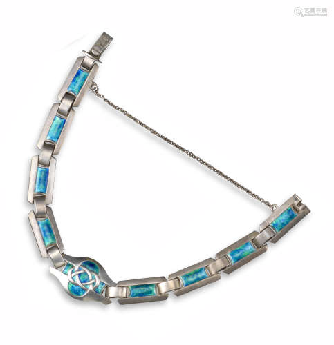 An Arts & Crafts silver and enamel bracelet by Murrle Bennett & Co, each panel decorated with blue