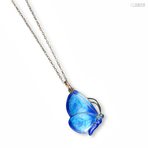 A silver and enamel butterfly pendant by Child & Child, the butterfly realistically designed with