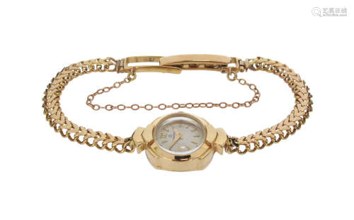 A lady's 18ct gold Omega wristwatch, the signed plain dial with Arabic and baton numerals in