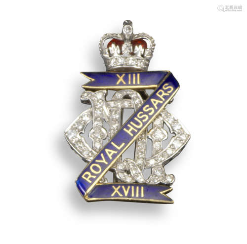 A Regimental brooch for the XIII - XVIII Royal Hussars, set with graduated circular-cut diamonds and