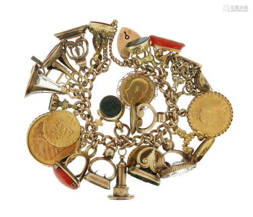 A gold charm bracelet, the curb-link gold bracelet suspending assorted charms including coins and
