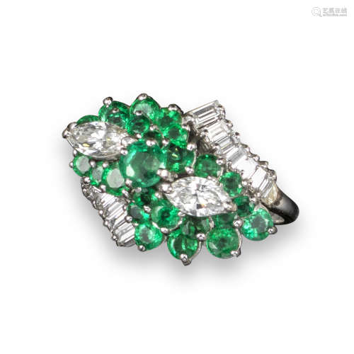 An emerald and diamond cluster ring, the architectural ring set with marquise-shaped diamonds,