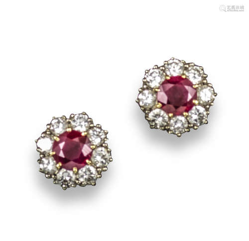 A pair of ruby and diamond cluster ear studs, the circular-cut rubies are set within a surround of
