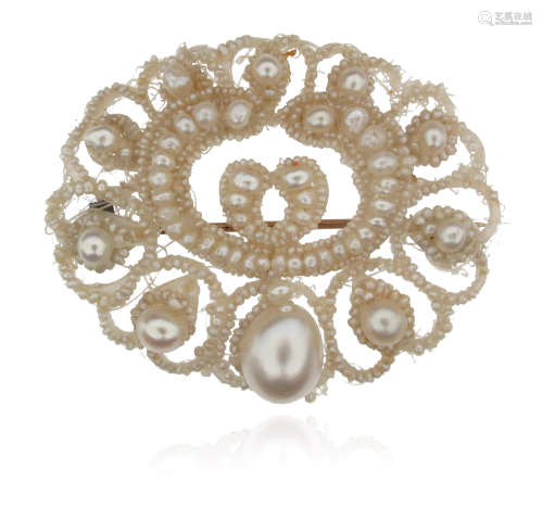 A George III pearl-mounted open work brooch, set on mother-of-pearl and suspending a larger oval-