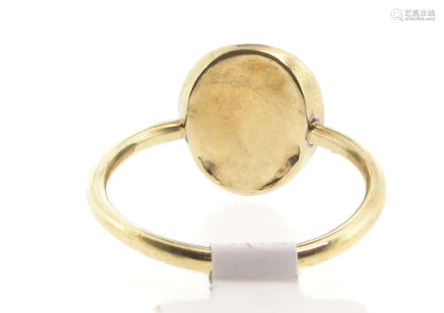 A 19th century cameo ring, the carved agate depicting a monkey's face in closed-back yellow gold