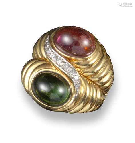 A tourmaline and diamond ring, set with a pink and green tourmaline cabochon conjoined with a