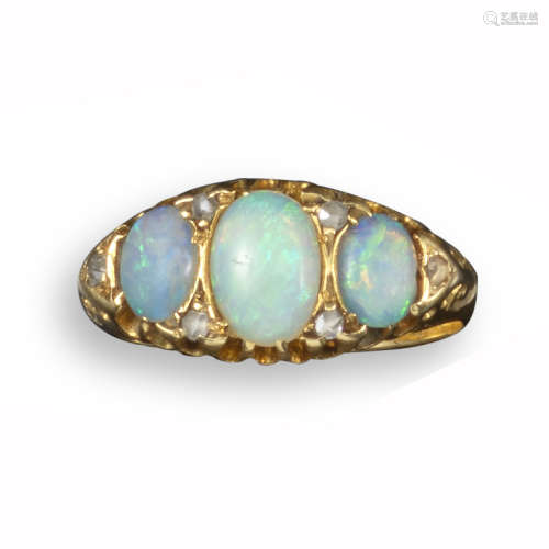 A Victorian opal and diamond ring, set with three graduated oval-shaped opals and diamond pointers
