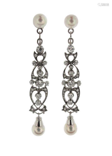A pair of cultured pearl and diamond drop earrings, the modern cultured pearl studs suspend
