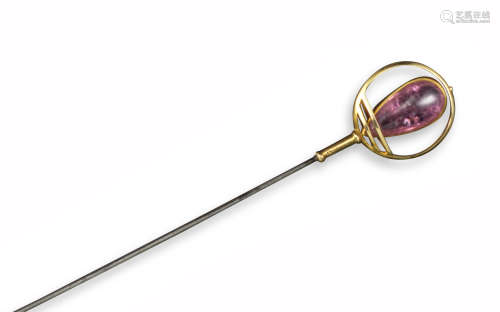 A pink tourmaline and gold hat pin by Murrle Bennett & Co., of circular design, mounted with a