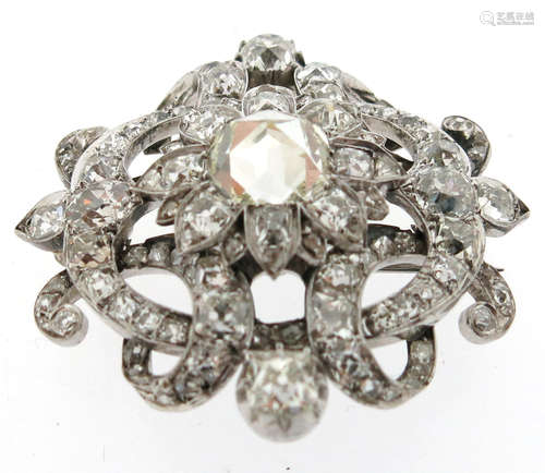 A Victorian diamond-set scroll brooch, the centre flowerhead section is set with a large rose-cut