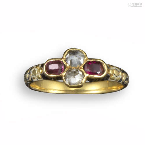 A 17th century diamond and garnet quatrefoil ring, set with two rose-cut diamonds and oval-shaped