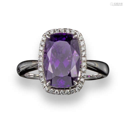 An amethyst and diamond cluster ring, set in white gold, stamped 4.11, size M
