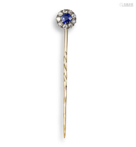 A sapphire and diamond stick pin, the circular-cut sapphire is set within a surround of diamonds