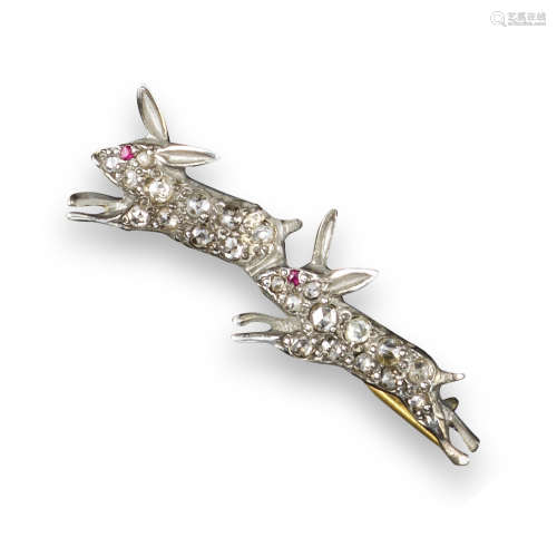A ruby and diamond running rabbit brooch, each rabbit set with rose-cut diamonds and a ruby eye in