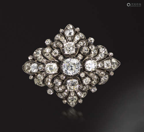 A late George III diamond-set brooch, c1820, the lozenge-shaped brooch centred with three larger