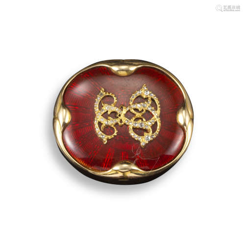 A late 19th century gold pill box, decorated with red guilloche enamel and applied with