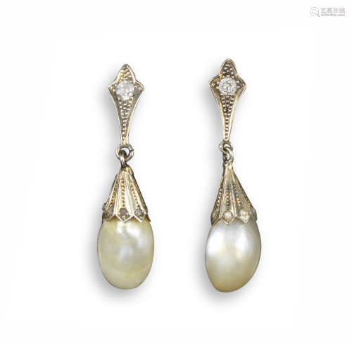 A pair of natural pearl drop earrings, the pearls suspend from diamond-set caps in white gold, 3.5cm