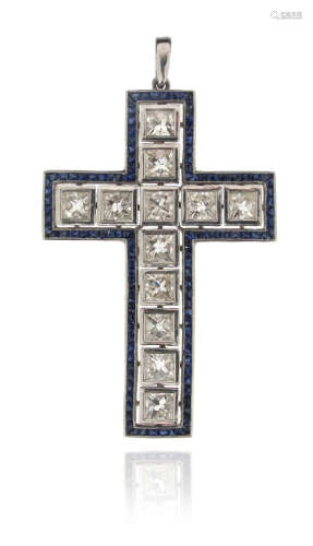 A diamond and sapphire cruciform pendant, centred with twelve square-shaped diamonds within a border