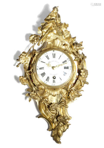 A Louis XV ormolu cartel clock by Herbault of Paris, the circular brass movement with four turned