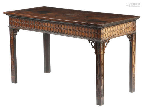 A George III mahogany serving or side table in Chippendale style, the rectangular top above a Gothic