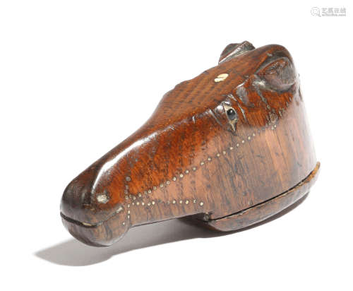 A 19th century treen snuff shoe in the form of a horse's head, with brass tack decoration and inlaid