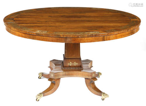 λ A Regency rosewood and brass marquetry centre table, the crossbanded top decorated with panels