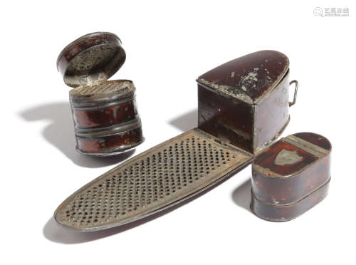 Three rare japanned tole nutmeg graters, one of navette shape, one cylindrical and the other oblong,