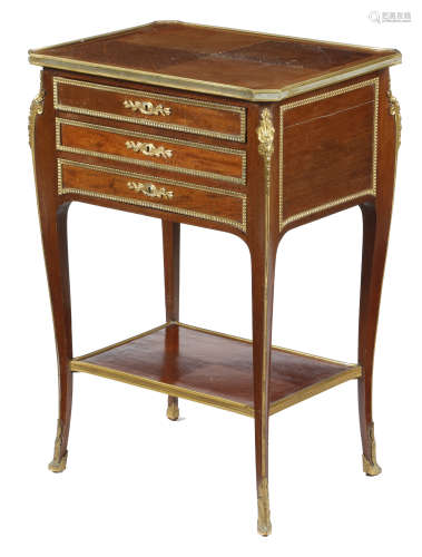 A French mahogany table en chiffoniere, with brass mounts, the crossbanded and quarter veneered