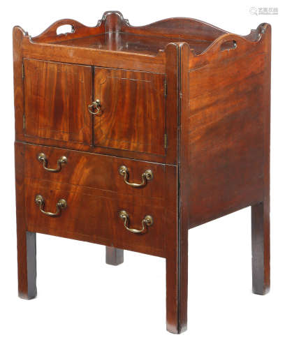 A George III mahogany tray-top bedside commode, the serpentine gallery pierced with two handgrips,