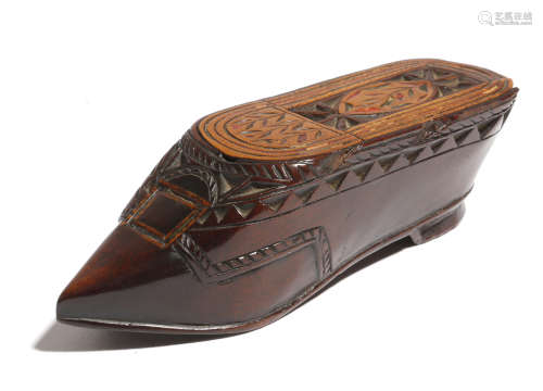 A late 19th century treen snuff shoe, with chip carved and polychrome decoration, with a sliding