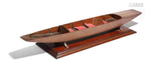 A scratch built wooden scale model of a punt, with four cushions, mounted on a mahogany base, late