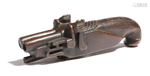 A 19th century treen pistol snuff box, carved as a double barrelled flintlock pistol, with a