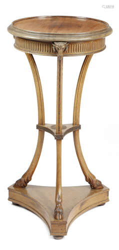 A late Victorian mahogany lamp stand in Adam style, the circular dished top above a fluted frieze